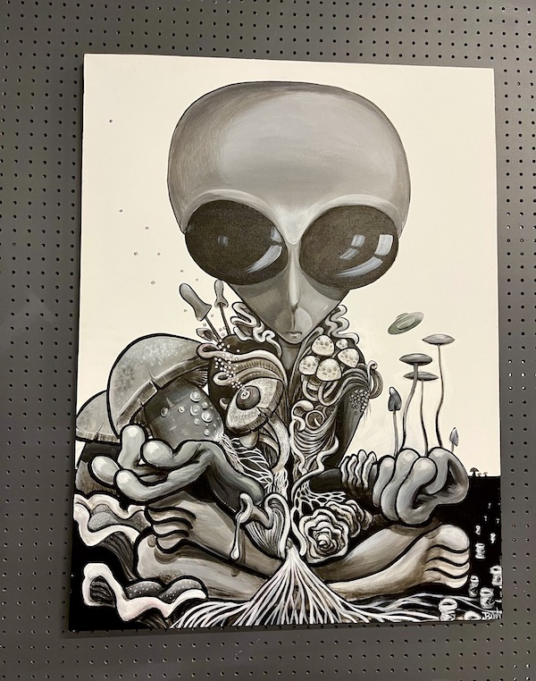 A black and white drawing of an alien at the International UFO Museum Roswell NM