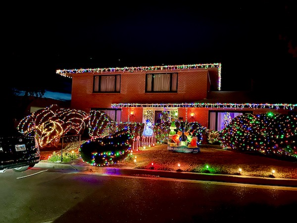 A two story red brick house along the Scenic Drive El Paso Texas decorated for Christmas 