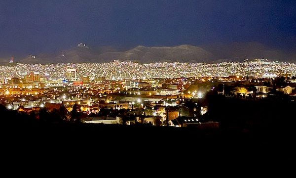 A view of city lights and mountains at night along the Scenic Drive El Paso Texas