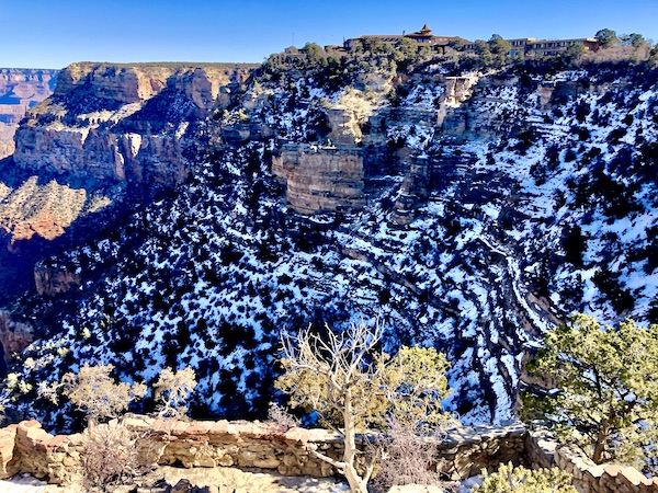 The rocky depths of the Grand Canyon with patches of snow seen before lunch at Fred Harvey Burger Grand Canyon AZ