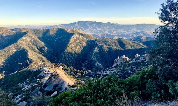 Light and shadow accentuate the peaks and valleys of the mountains.