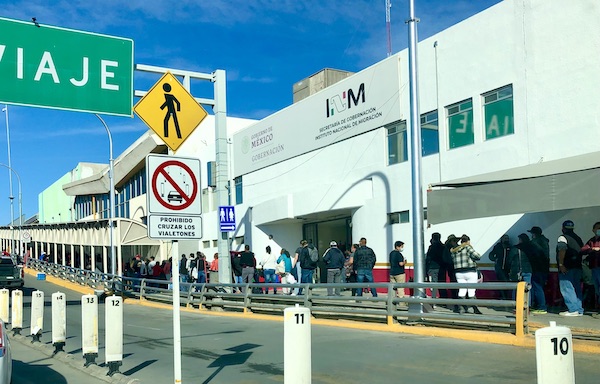 Cars and lots of people crossing the border from Our Trip to Mexico and Lunch