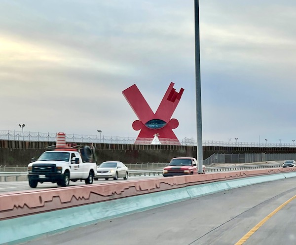 A huge bright ret X seen from the highway.
