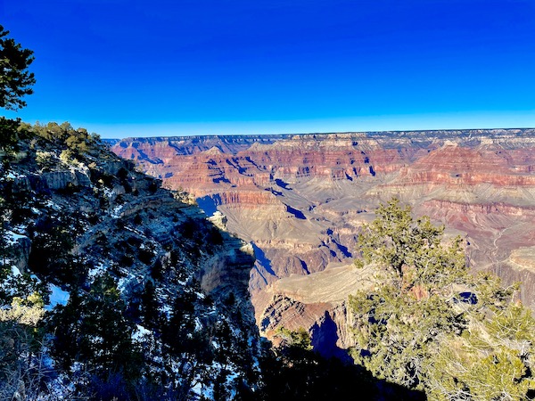 Shadows and sunshine enhance the colors of the South Rim Grand Canyon Arizona