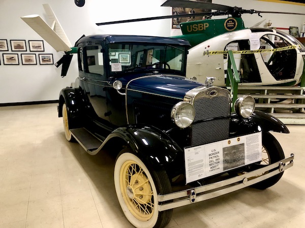 A black antique car confiscated by the US Border Patrol on display at the Museum El Paso