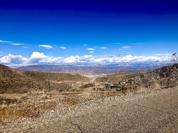 A view of a valley with homes and mountains