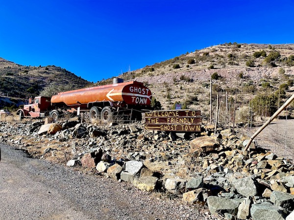And rusty tanker and a brown sign welcoming you to the Friendly Ghost Town Haynes AZ