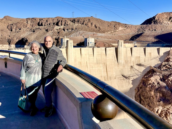 A couple standing by a wall at Hoover Dam