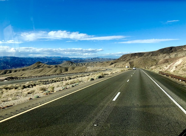 A highways with mountains, desert and blue sky on our way to Hoover Dam Lake Mead NV