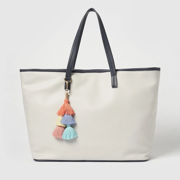 A light gray tote with black trip and a colorful tassel is one of my new warm weather favorites.