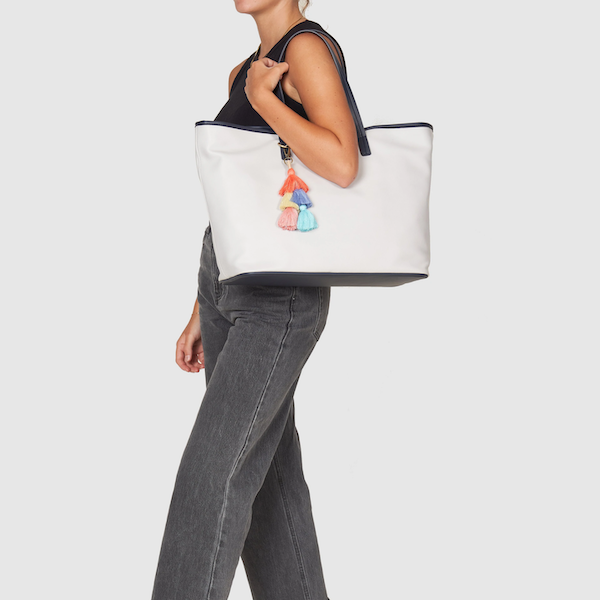 A woman in black with a gray tote on her shoulder. This tote is one of my new warm weather favorites.