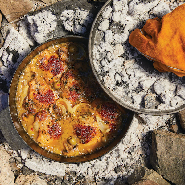 A black pot with food on hot coals is a new warm weather favorite.