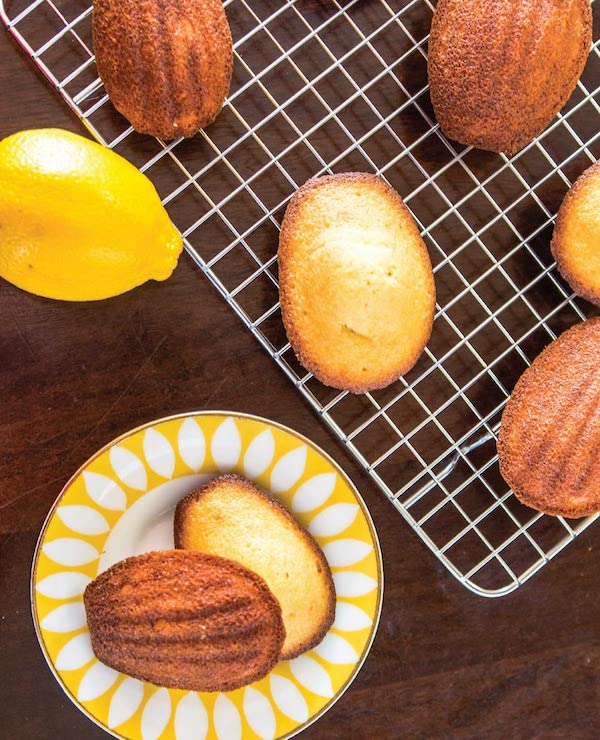 A plate with oval cookies, a cooling rack and a lemon from one of my New Warm Weather Favorites A