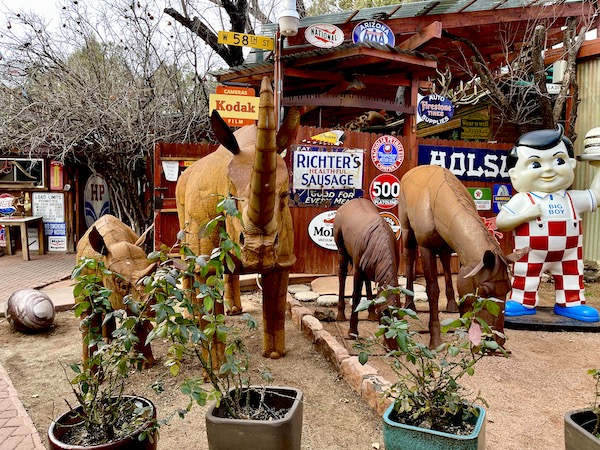 A rhino, elk, horses and hippo metal sculptures at a gallery near the Red Rocks of Sedona Arizona