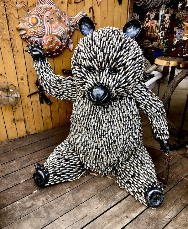 A black and white teddybear sculpture made of spark plugs at a gallery near the Red Rocks of Sedona Arizona