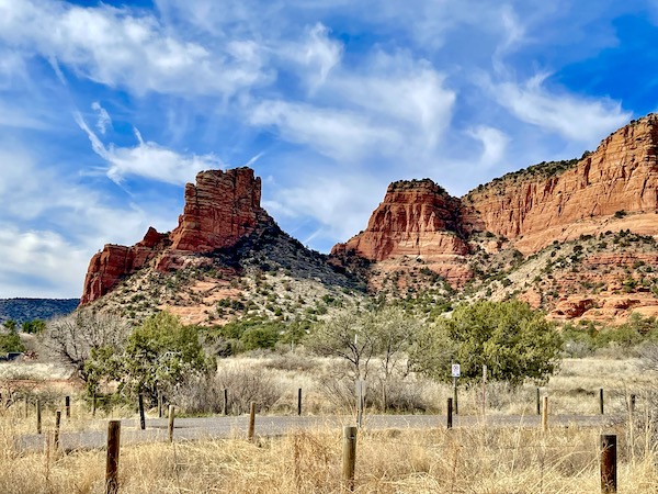 Red Rocks of Sedona Arizona. sand, vegetation, wire fencing and posts.