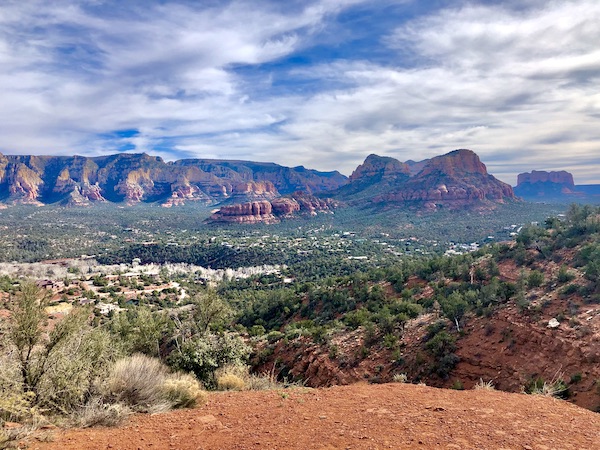 Red Rocks of Sedona Arizona with plants and dirt in the foreground