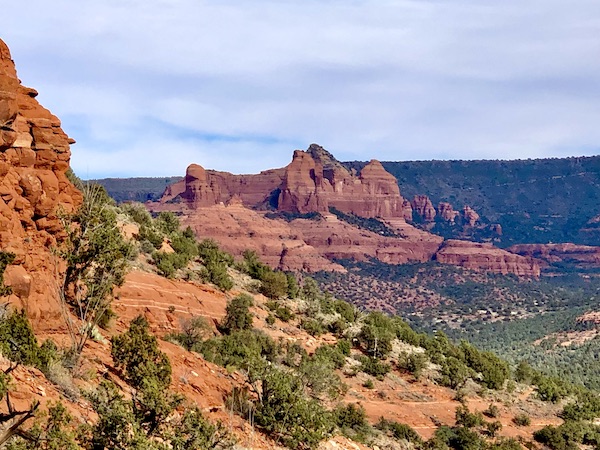 Red rock formation that looks like a beagle dog on his back, hence the name Snoopy Rock.