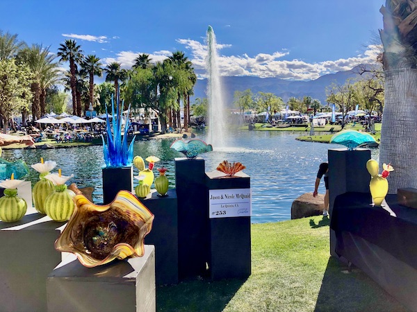 Pedestals displaying assorted glass sculptures at La Quinta Art Celebration California