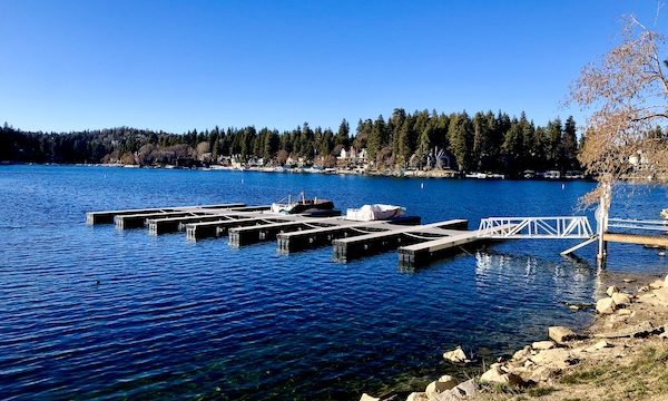 A deep blue lake with boat slips is Lake Arrowhead California