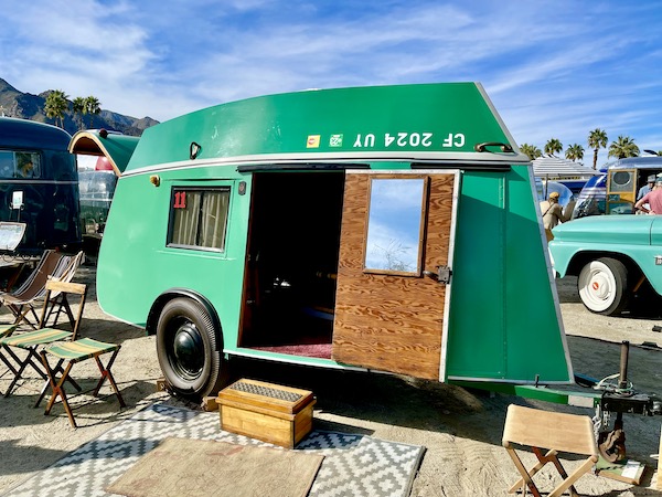 A green camper/boat at the Palm Springs CA Vintage Trailer Show