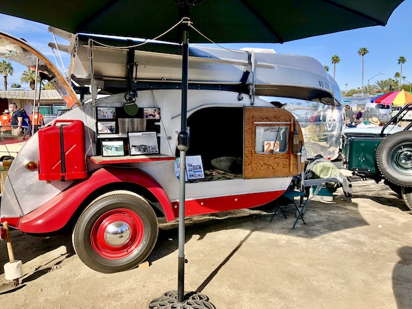 A red and aluminum prototype for a camper boat at the Palm Springs CA Vintage Trailer Show