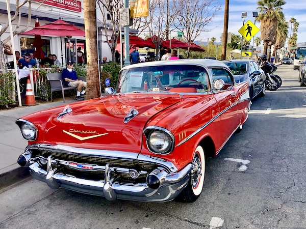 A red vintage car with white top.