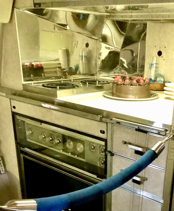An airplane galley with a chocolate cake on the counter at the Ronald Reagan Presidential Library
