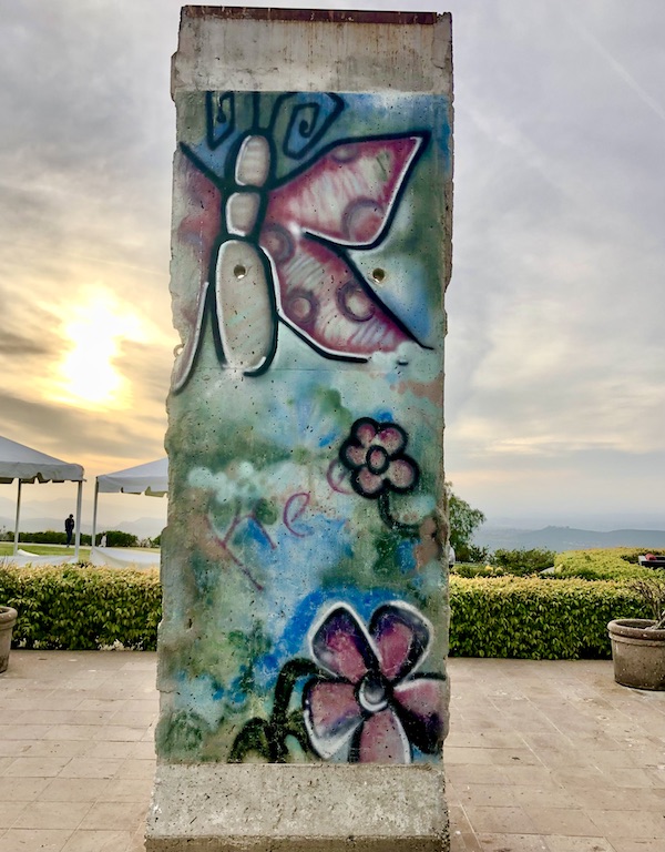 A pillar with painted flowers and butterflies outside the Ronald Reagan Presidential Library