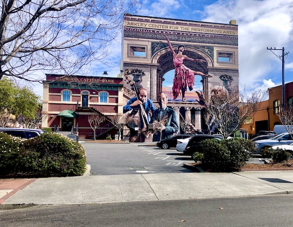 A brick building with a mural of musicians and a dancer along the California Northern Coast Part II
