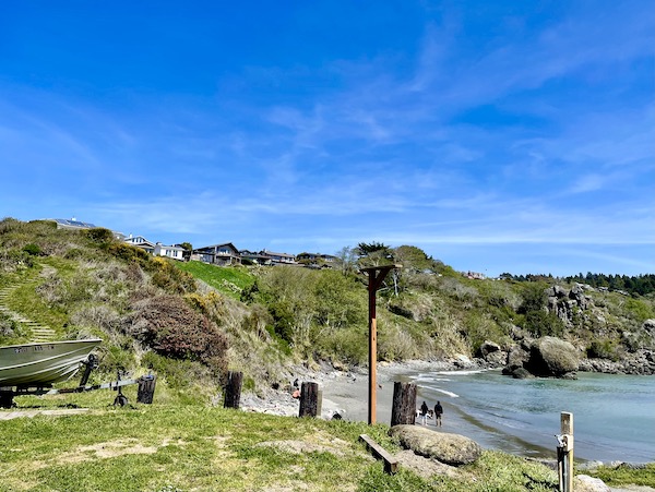 An ocean cove with mountains and homes along the California Northern Coast Part II