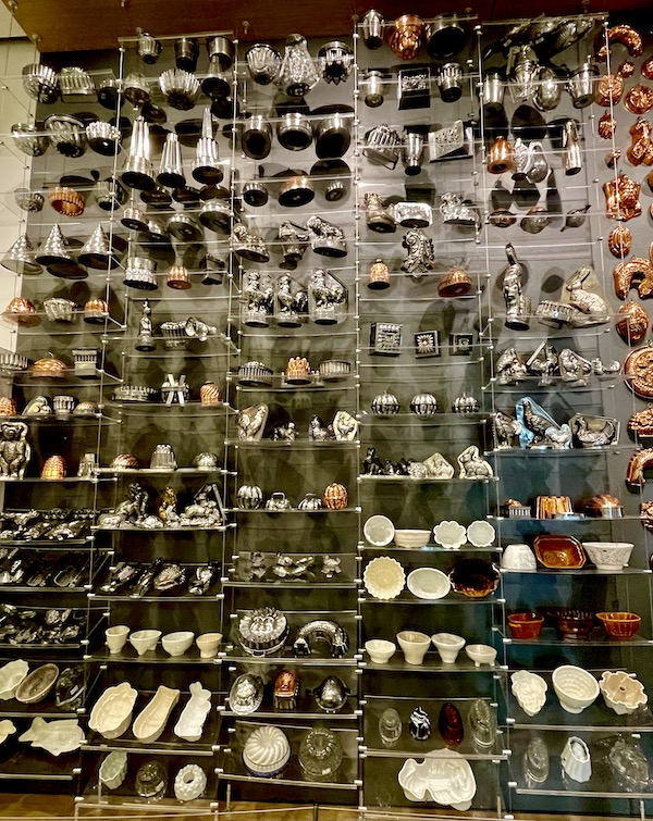 A display wall of assorted bowls and molds seen while having Fun in Downtown Napa CA