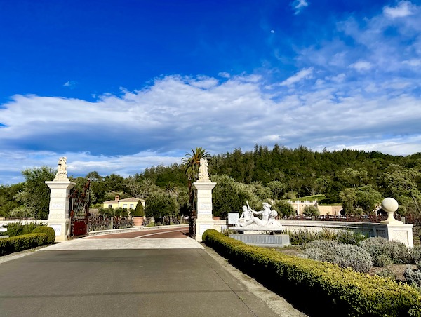 White pillars mark the entrance to an Italian style winery on our Napa Valley Winery Tour