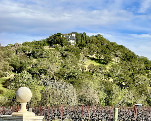 A large white house nestled in a mountain on our Napa Valley Winery Tour