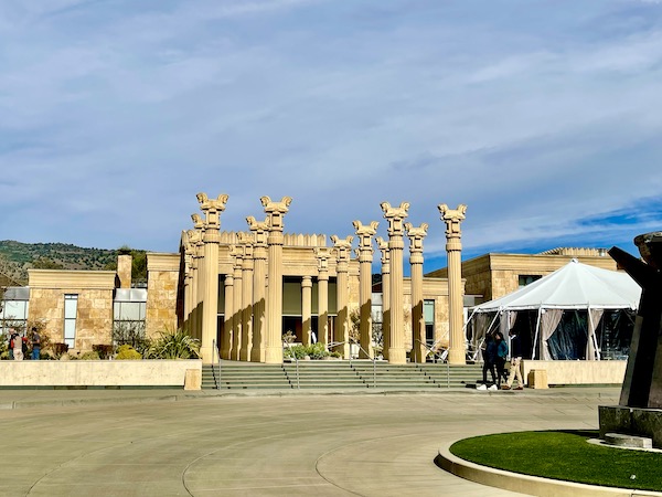 A beige building with lots of columns and landscaping on our Napa Valley Winery Tour