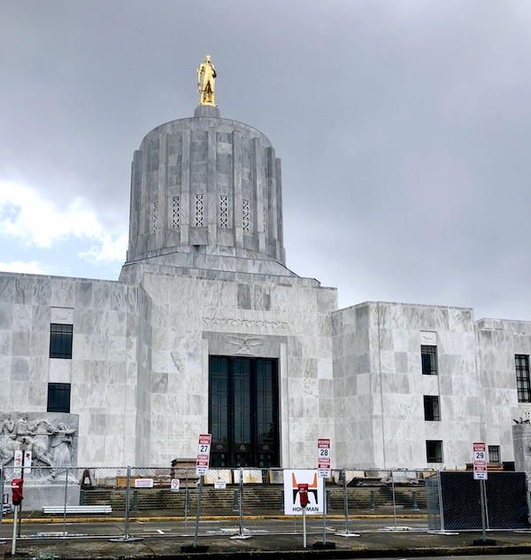 White concrete building with gold statue at top seen before visiting Alpacas at Marquam Hill Ranch