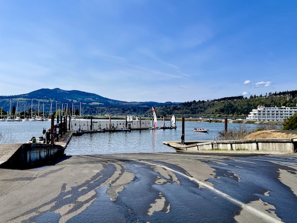 A wet parking lot, docks, mountains and a river on our way home from Mt. Hood Oregon