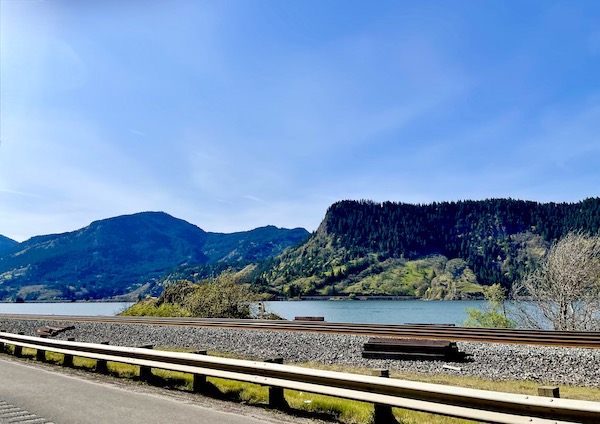 Scenic drive along a river with mountains on our way back from Mt. Hood Oregon