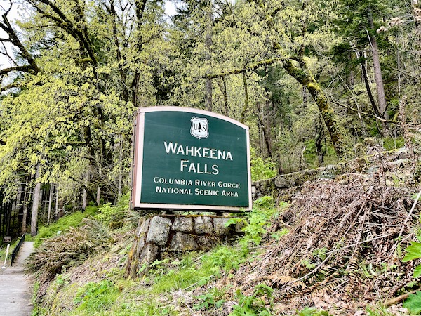 A large green and ivory sign for Wahkeena Falls near Multnomah Falls Oregon