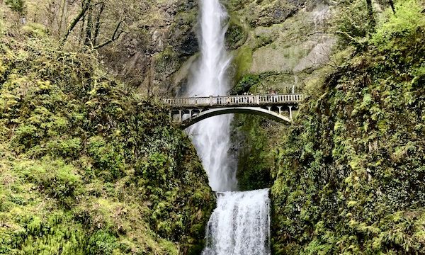 A very long, two tiered waterfall with a bridge is Multnomah Falls Oregon