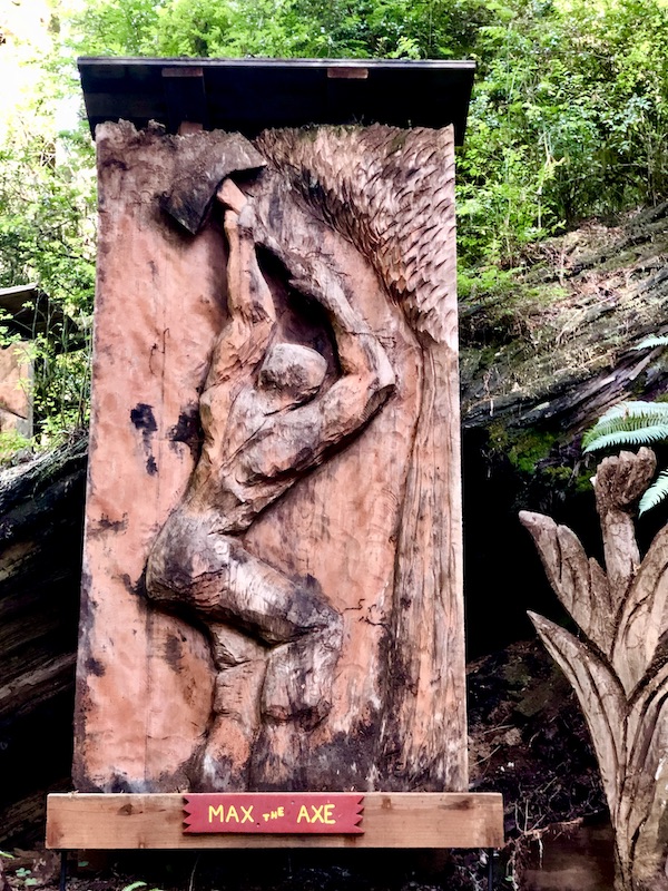 Redwood carving relief of am man wielding an axe at Trees of Mystery Klamath CA