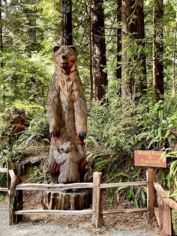 A huge bear sculpture with a baby bear at base.