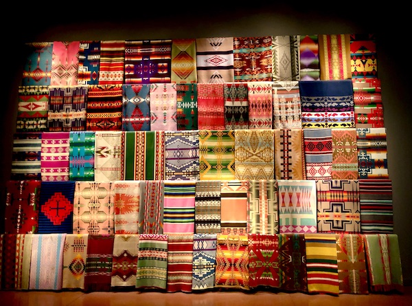 Colorful American Indian trade blankets on display at Chihuly Gardens Seattle WA