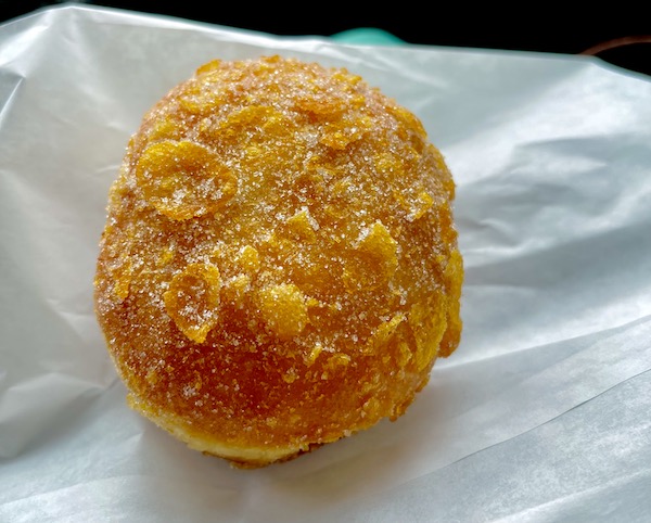 A round pastry on white paper from a bakery in Seattle WA