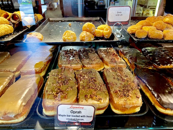 Long slender donuts with maple icing and chopped bacon at Legendary Doughnuts Tacoma WA