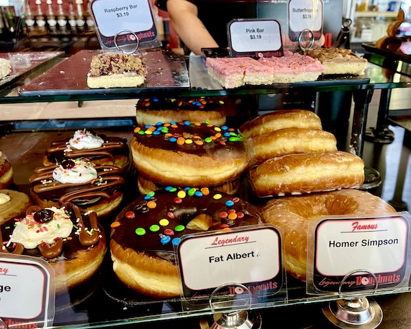 A close-up of donuts in a case at Legendary Doughnuts Tacoma WA