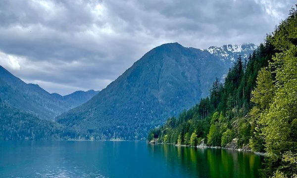 Tree covered mountains and their reflection in Olympic Peninsula Washington