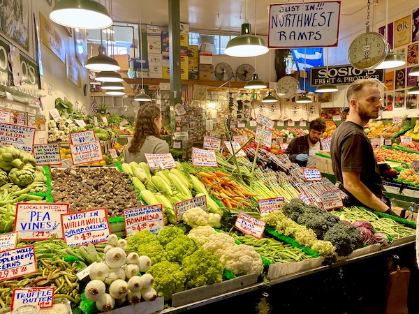 A display of vegetables for sale at Pike Place Market Seattle WA