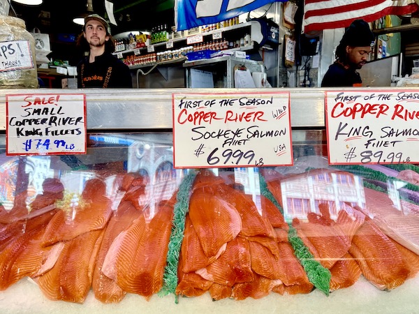 Various salmon filets on ice at Pike Place Market Seattle WA