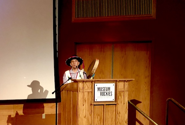 Crow Indian speaking at a podium at the Museum of the Rockies Bozeman MT